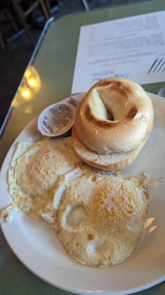 Bagel with Cream Cheese and Two Eggs over Easy